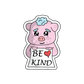 Adorable piggy surrounded by hearts sticker, holding a sign that reads 'Be Kind,' embracing the essence of compassion.