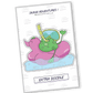 Sticker of a funny frog sitting on an inflatable duck in the water, equipped for diving adventures, exuding humor and aquatic charm