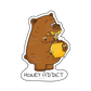 A sticker of a cute big bear eating honey from a pot surrounded by small cute bees, with the text 'Honey Addict,' symbolizing joy and nature's sweetness.