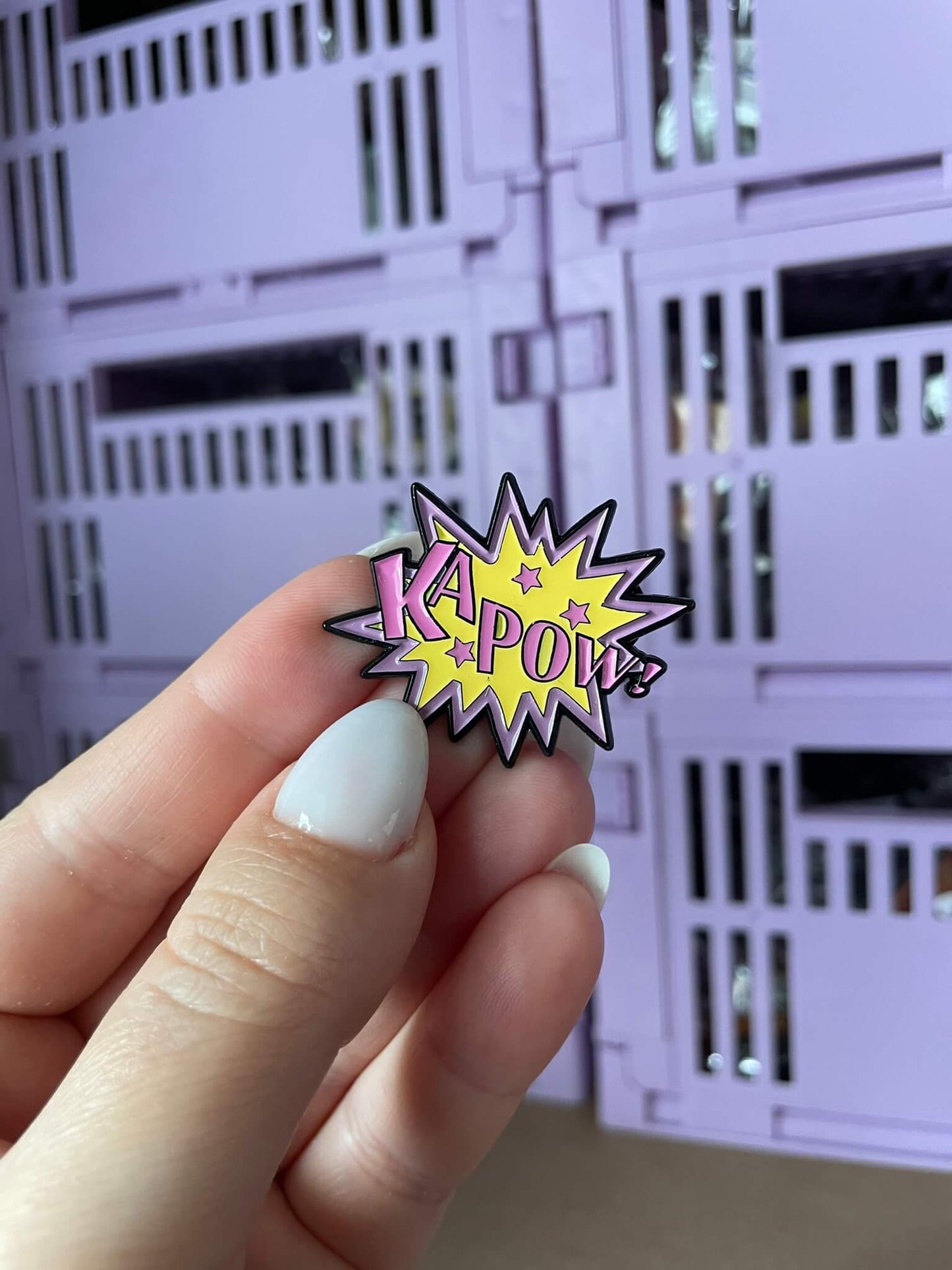 Retro 'KAPOW!!' Enamel Pin - A fun enamel pin featuring the word 'KAPOW!!' in retro-inspired lettering, perfect for fans of vintage comic book action and all things retro.