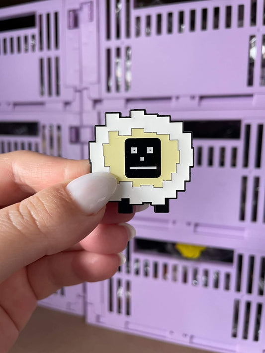 Robo Sheep Enamel Pin - A delightful enamel pin featuring a cute sheep with a robotic twist, perfect for tech enthusiasts and lovers of all things cute and innovative.