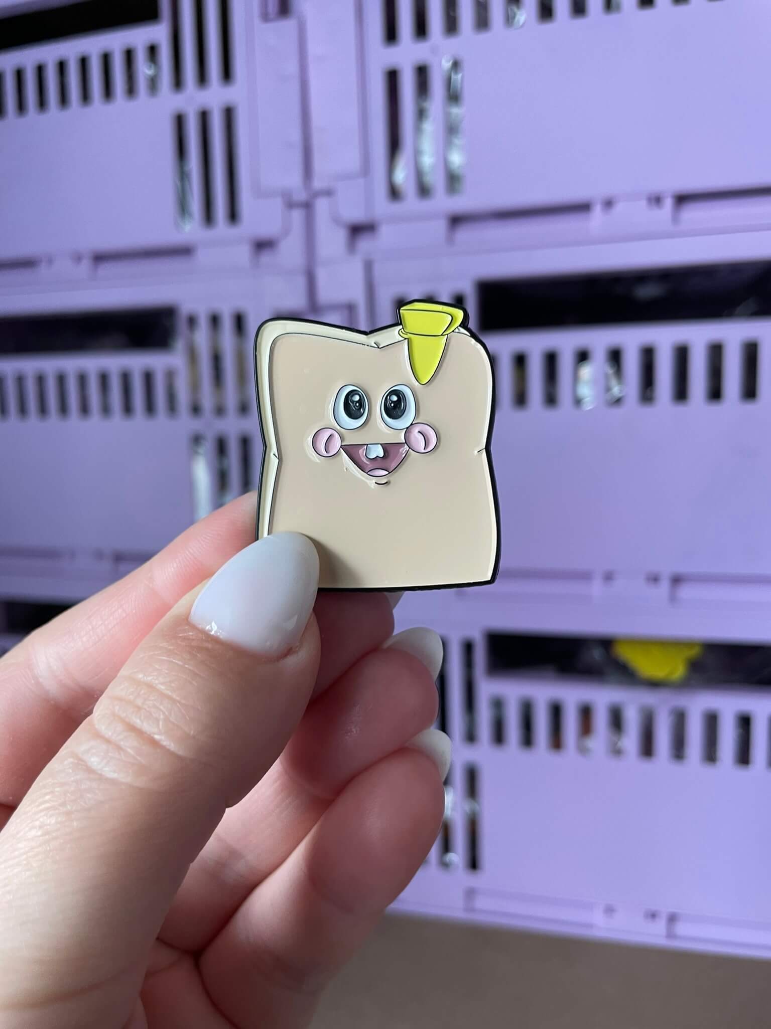 Baby Toasty Enamel Pin - A heartwarming enamel pin featuring a cute, blushing toast character, perfect for food lovers and fans of all things adorable.